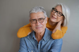 Older couple both wearing glasses