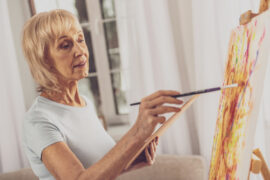 Woman painting on a canvas