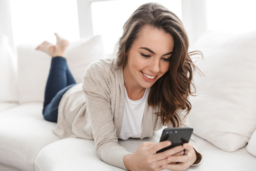 Girl on couch on phone 