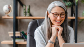 Woman Looking at Her Laptop Computer