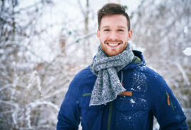 Happy man outside winter time