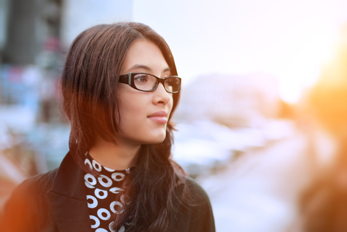 Young woman with glasses considering LASIK
