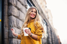 Woman outside with glasses and drink